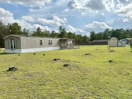 a view of a swimming pool with an outdoor seating