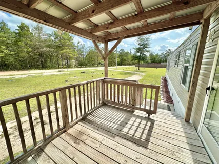 a view of balcony with wooden floor