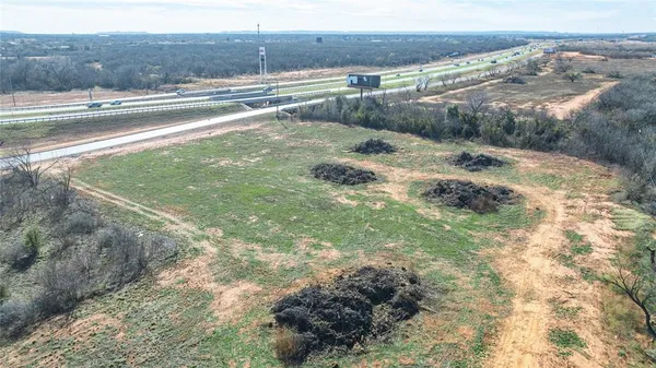 a view of a balcony with floor to ceiling windows