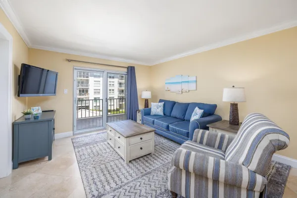 a living room with furniture and a window