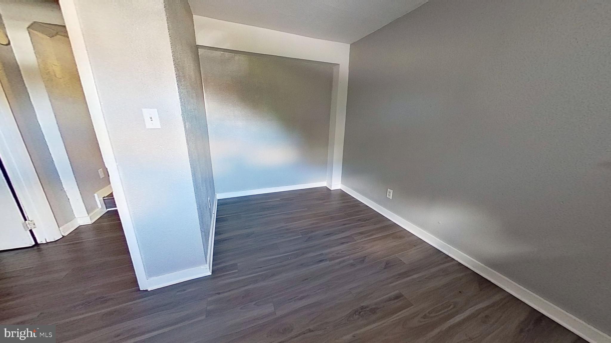 155 West Main Street, Unit 17 Windsor, PA 17366 - Photo 8 of 8 an empty room with wooden floor and entrance