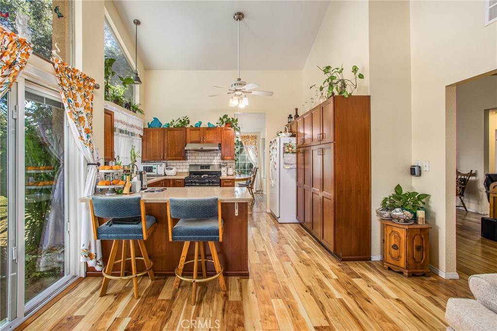 13503 Mulberry Circle Yucaipa, CA 92399 - Photo 12 of 28 a view of a dining room with furniture window and wooden floor
