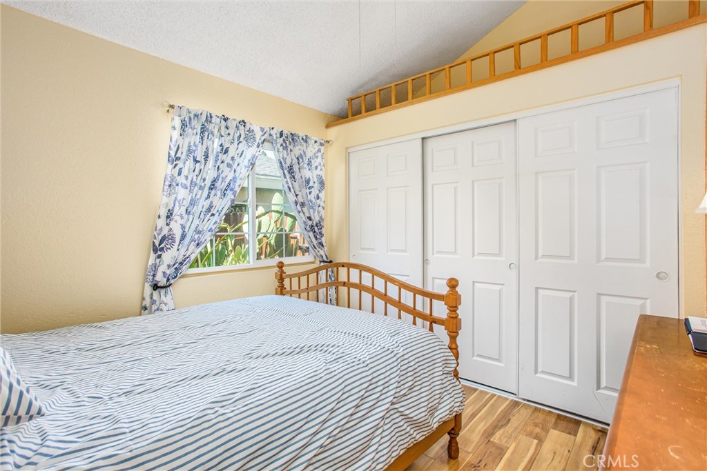 13503 Mulberry Circle Yucaipa, CA 92399 - Photo 14 of 28 a bedroom with a bed and a window