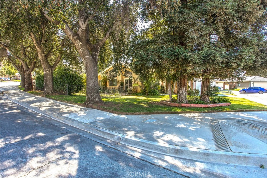 13503 Mulberry Circle Yucaipa, CA 92399 - Photo 19 of 28 a view of a yard with yellow house