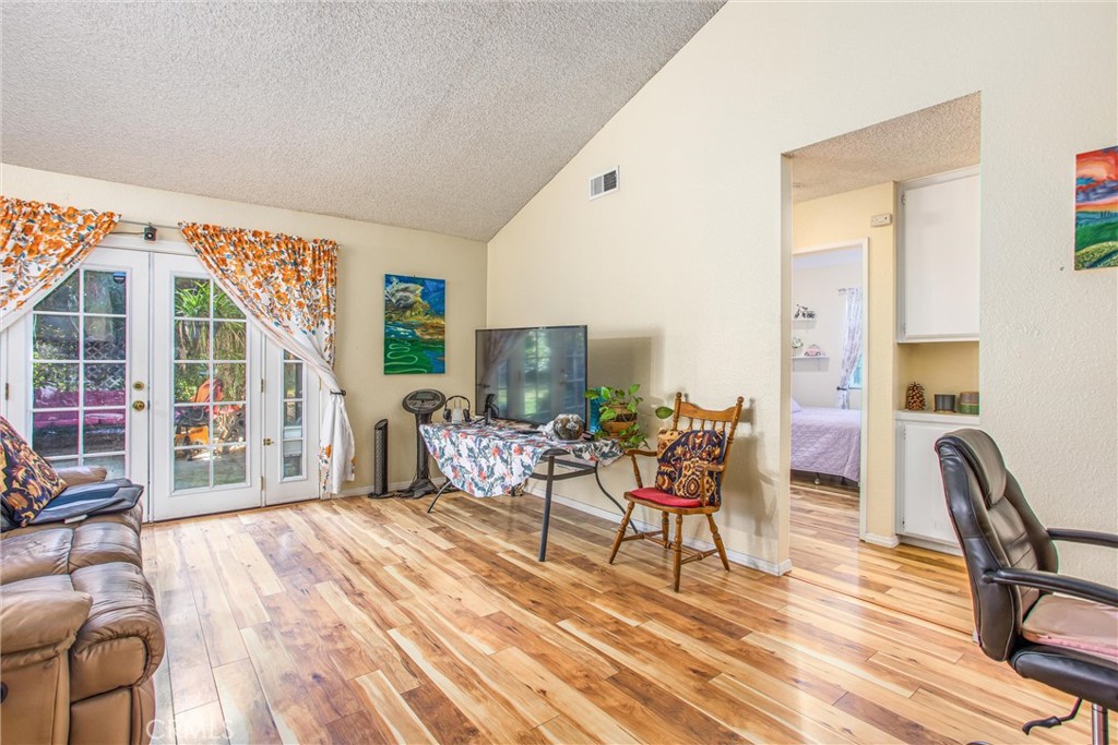 13503 Mulberry Circle Yucaipa, CA 92399 - Photo 4 of 28 a living room with furniture and a flat screen tv
