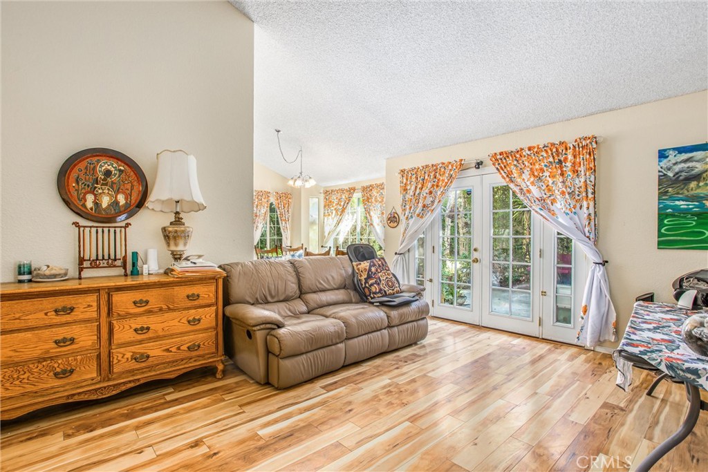 13503 Mulberry Circle Yucaipa, CA 92399 - Photo 6 of 28 a living room with furniture and a large window