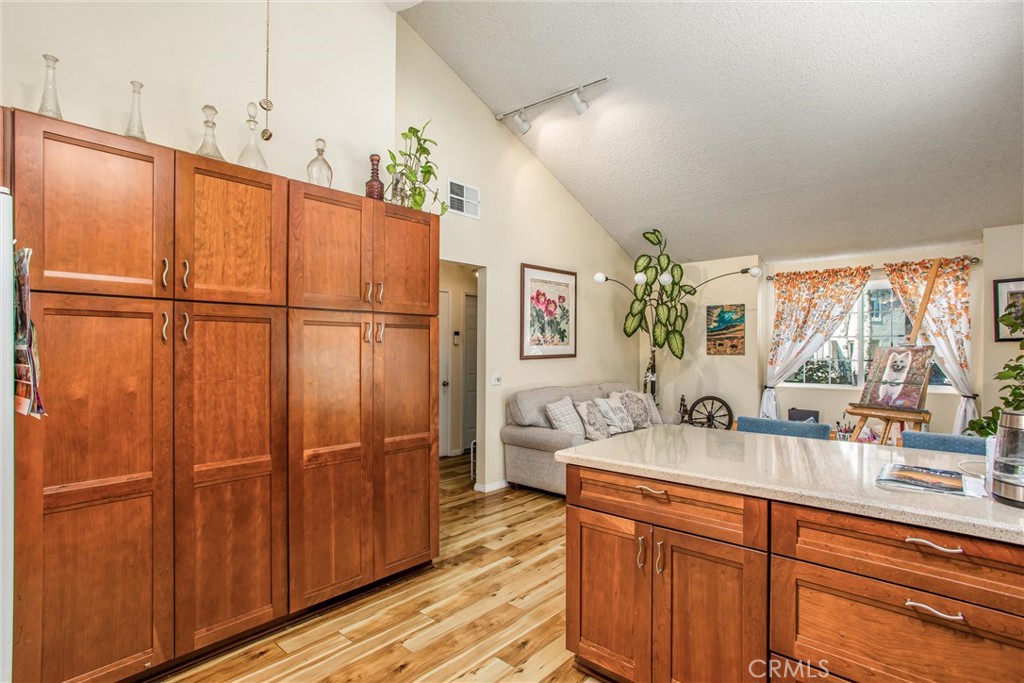 13503 Mulberry Circle Yucaipa, CA 92399 - Photo 10 of 28 a kitchen with sink a refrigerator and washer