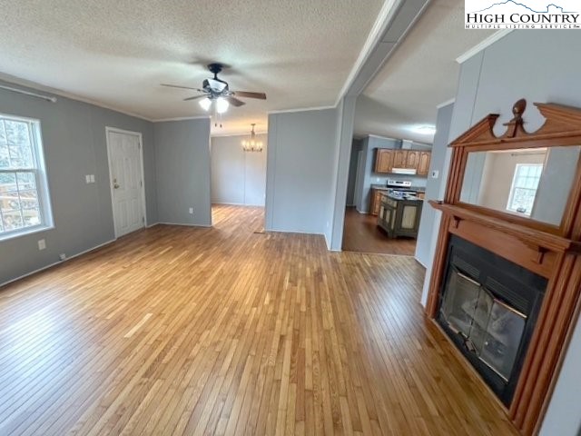 68 Rhoneys View Road Newland, NC 28657 - Photo 15 of 37 a view of livingroom with hardwood floor and a ceiling fan