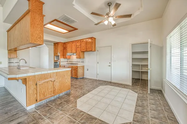 a view of hallway with wooden floor
