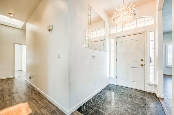 a view of a kitchen with a sink and cabinets