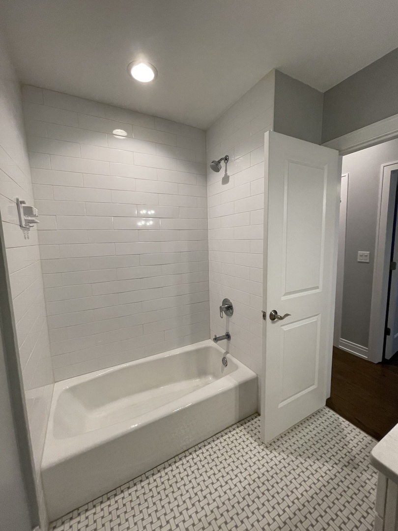 2036 West 18th Street, Unit 4 Chicago, IL 60608 - Photo 14 of 29 a bathroom with a bathtub and a shower