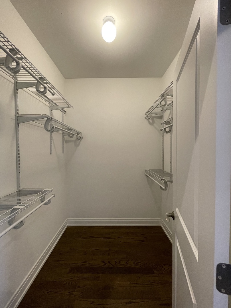 2036 West 18th Street, Unit 4 Chicago, IL 60608 - Photo 23 of 29 a view of a room with racks on the wall