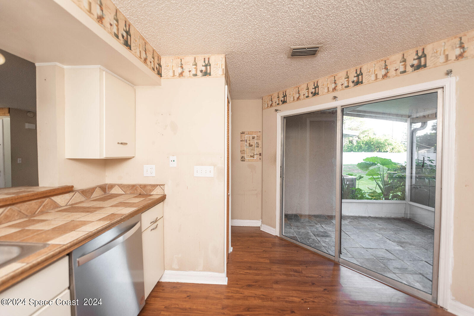 1880 Murrell Road, Unit F24 Rockledge, FL 32955 - Photo 14 of 45 a kitchen with granite countertop a sink and a stove