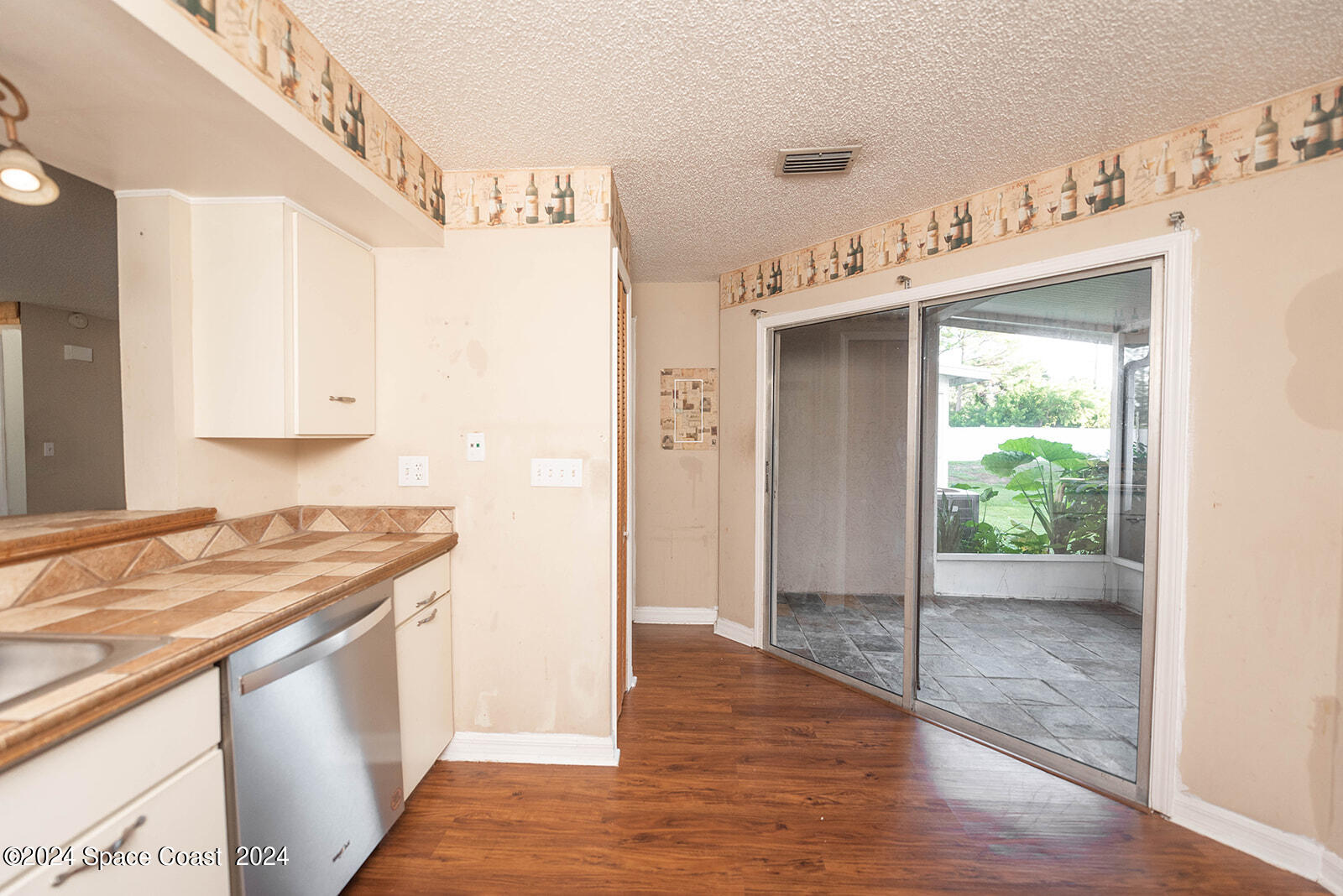 1880 Murrell Road, Unit F24 Rockledge, FL 32955 - Photo 15 of 45 a kitchen with a sink and a refrigerator