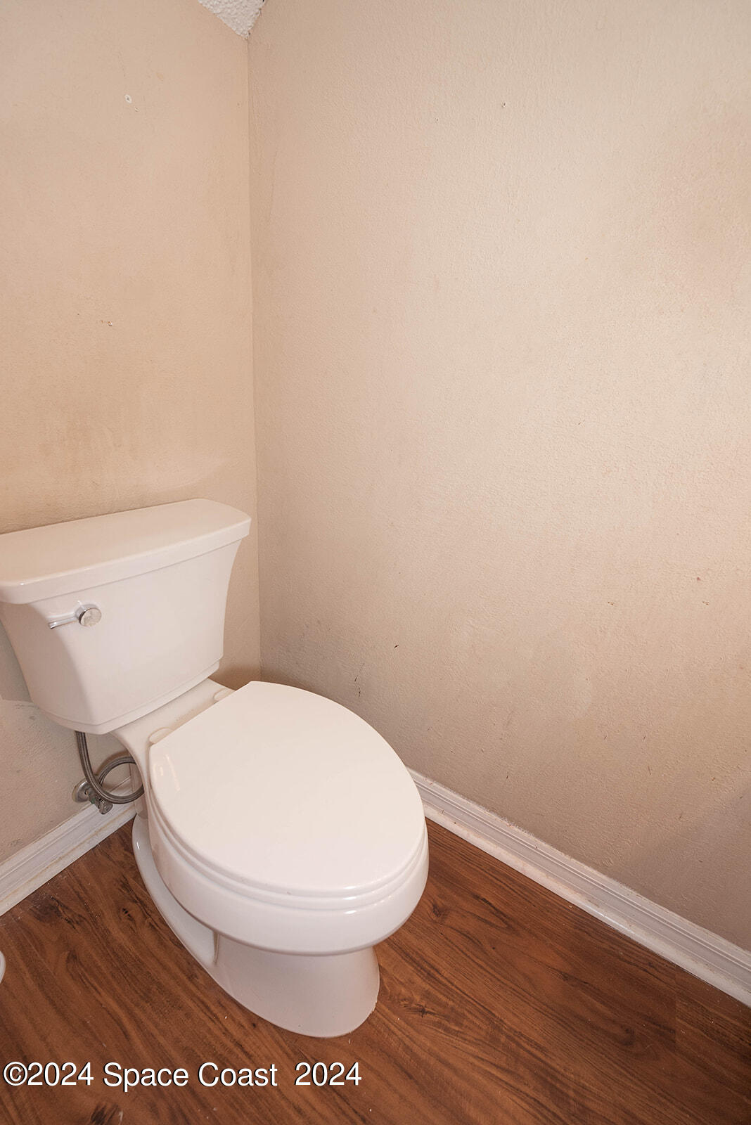 1880 Murrell Road, Unit F24 Rockledge, FL 32955 - Photo 19 of 45 a white toilet sitting next to a white wall