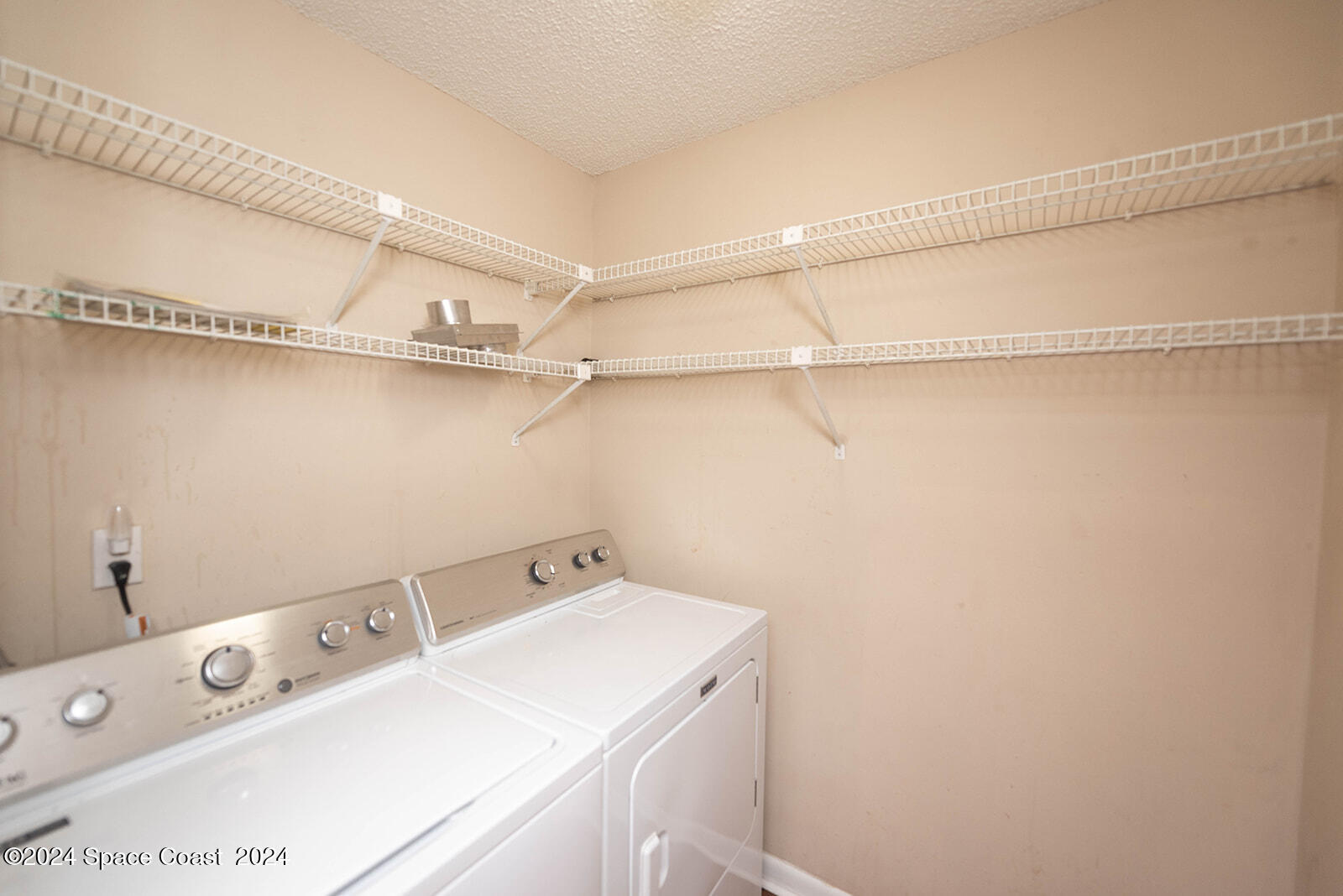 1880 Murrell Road, Unit F24 Rockledge, FL 32955 - Photo 20 of 45 a utility room with dryer and washer