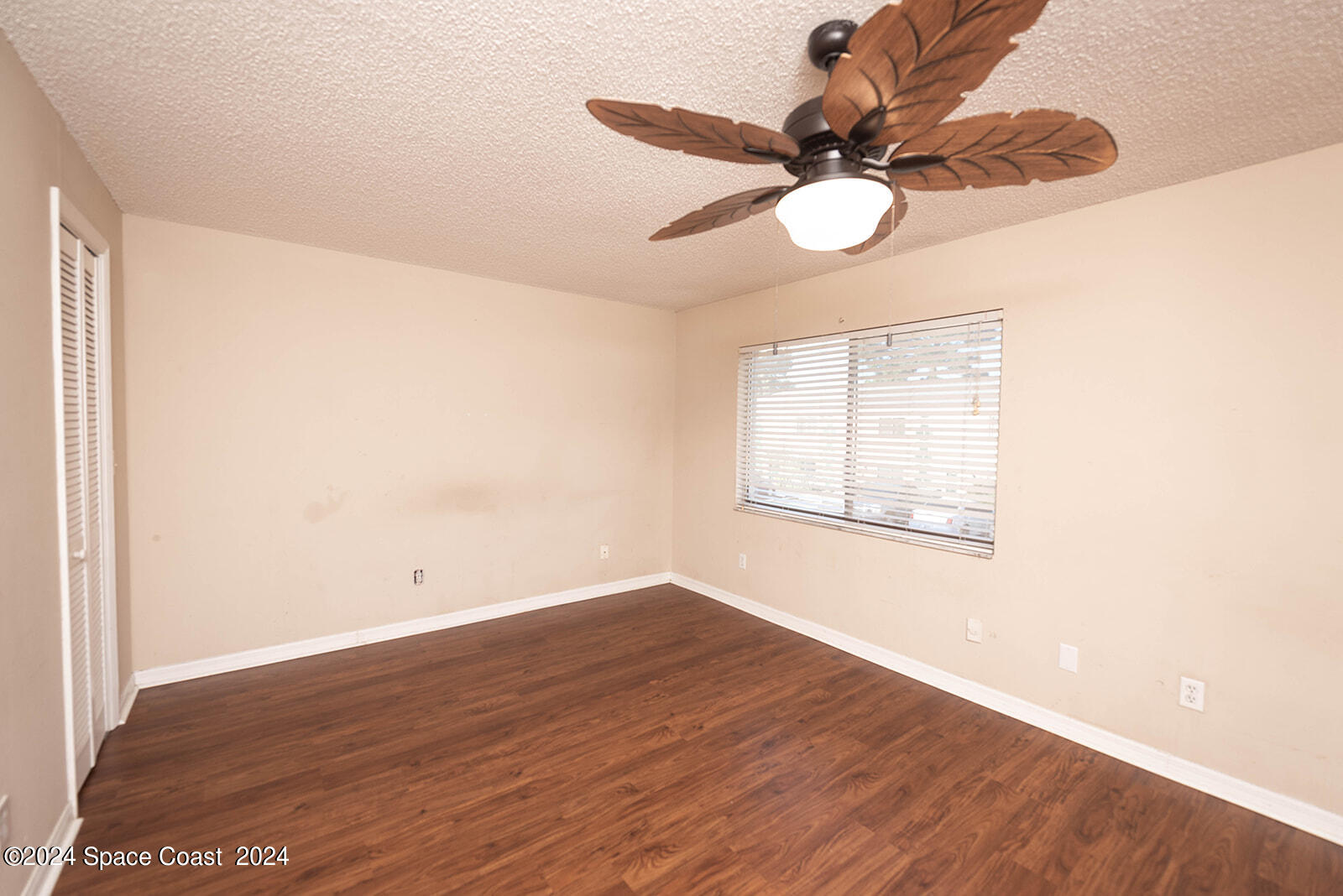 1880 Murrell Road, Unit F24 Rockledge, FL 32955 - Photo 29 of 45 a view of empty room with wooden floor