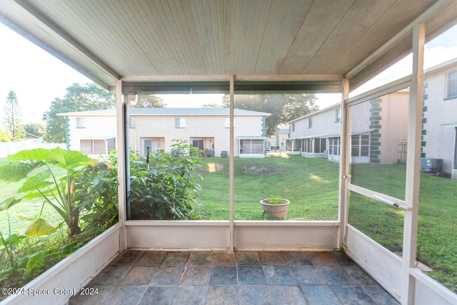 1880 Murrell Road, Unit F24 Rockledge, FL 32955 - Photo 32 of 45 a view of a porch with a big yard