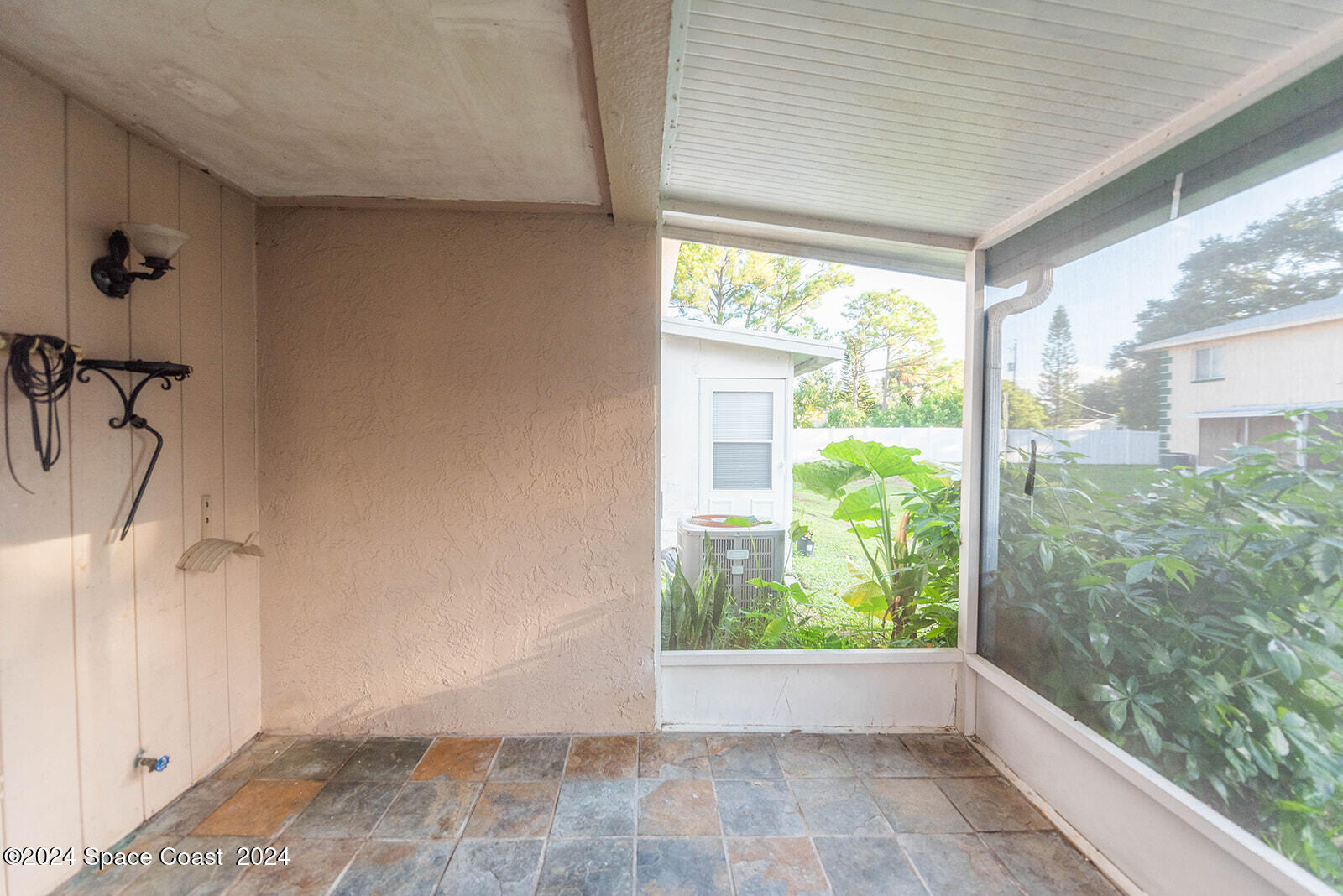 1880 Murrell Road, Unit F24 Rockledge, FL 32955 - Photo 33 of 45 a view of an empty room and window