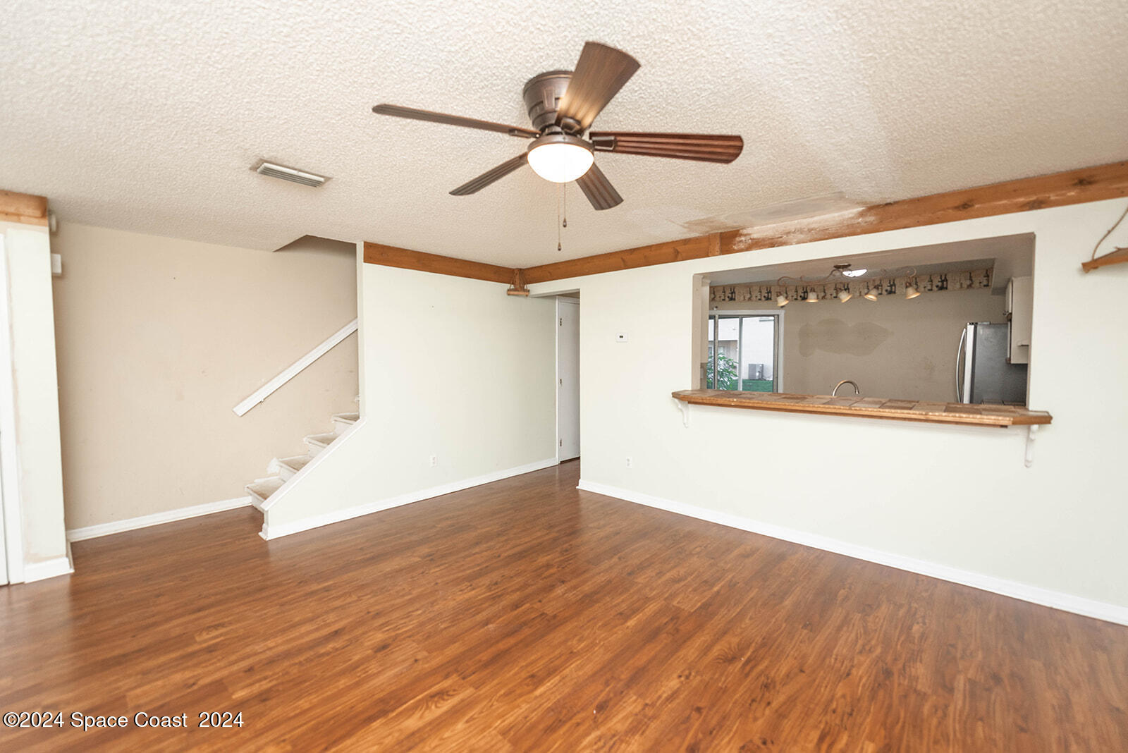 1880 Murrell Road, Unit F24 Rockledge, FL 32955 - Photo 4 of 45 a view of empty room with wooden floor