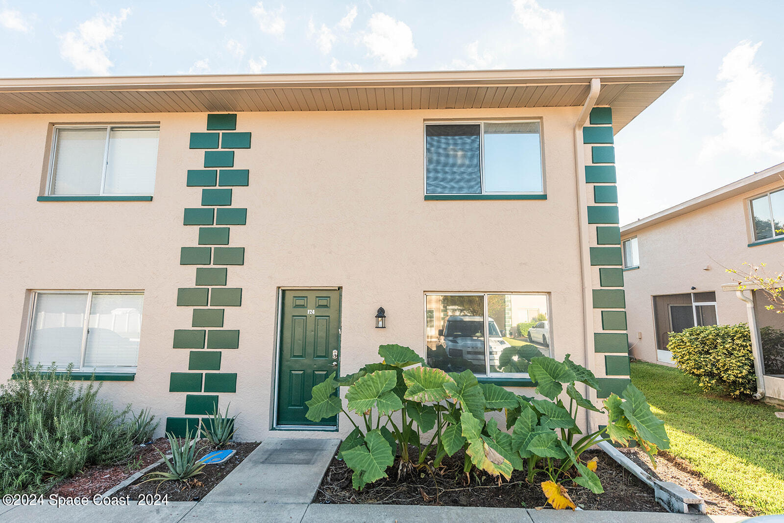 1880 Murrell Road, Unit F24 Rockledge, FL 32955 - Photo 41 of 45 a front view of a house with a yard