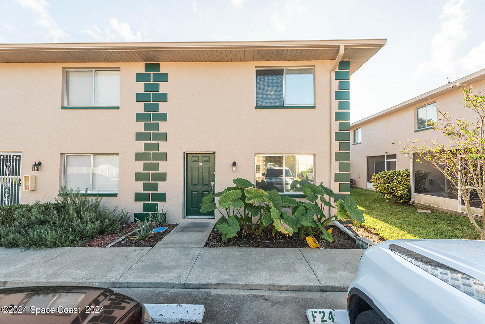 1880 Murrell Road, Unit F24 Rockledge, FL 32955 - Photo 43 of 45 a view of a building with potted plants