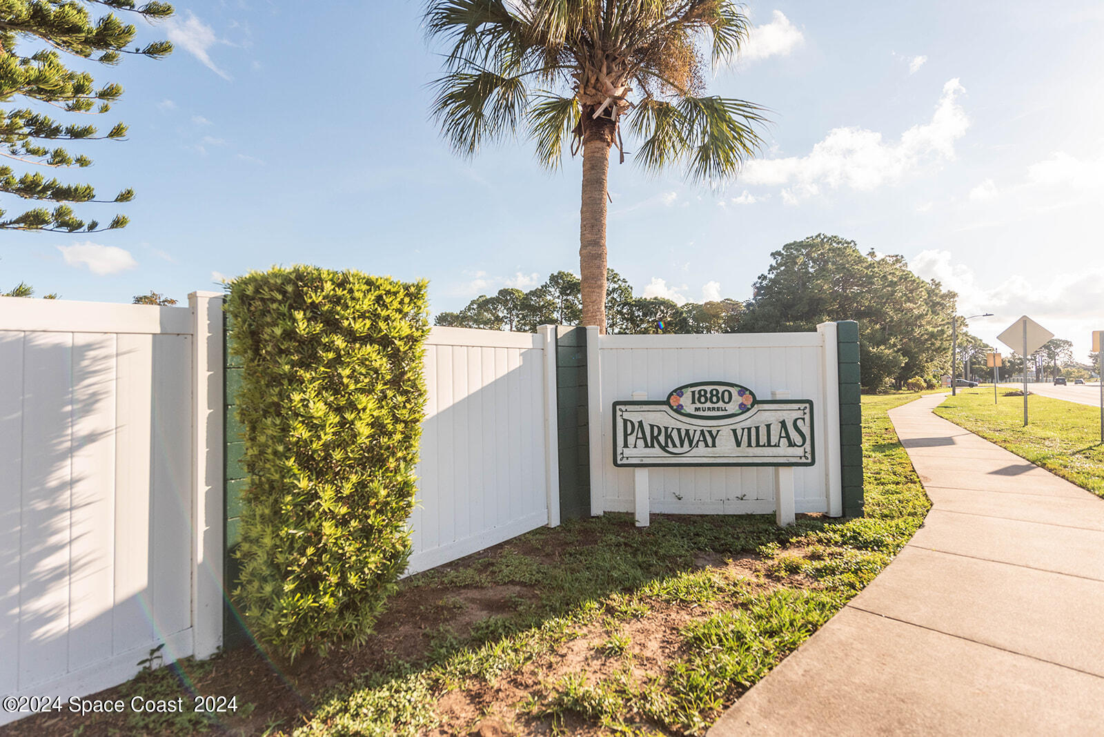 1880 Murrell Road, Unit F24 Rockledge, FL 32955 - Photo 44 of 45 a view of a sign board with buildings in the background