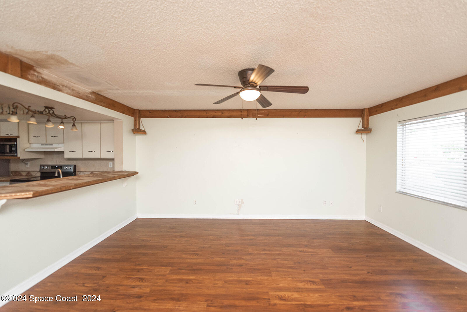 1880 Murrell Road, Unit F24 Rockledge, FL 32955 - Photo 7 of 45 a view of a room with wooden floor and a window