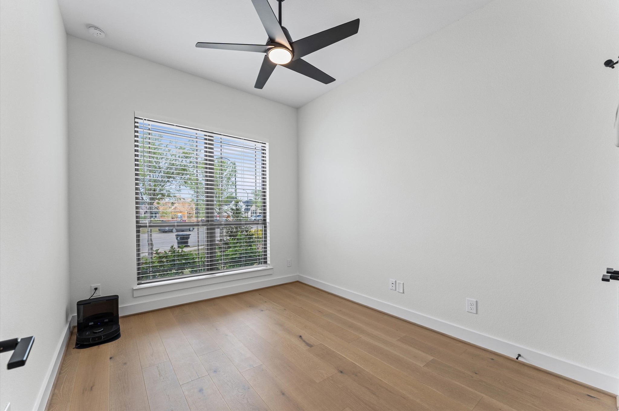 7327 Trial Rdg Drive Fulshear, TX 77441 - Photo 12 of 24 Natural light pours through this bedroom — a calm, comfortable space with generous square footage and a layout that just works.