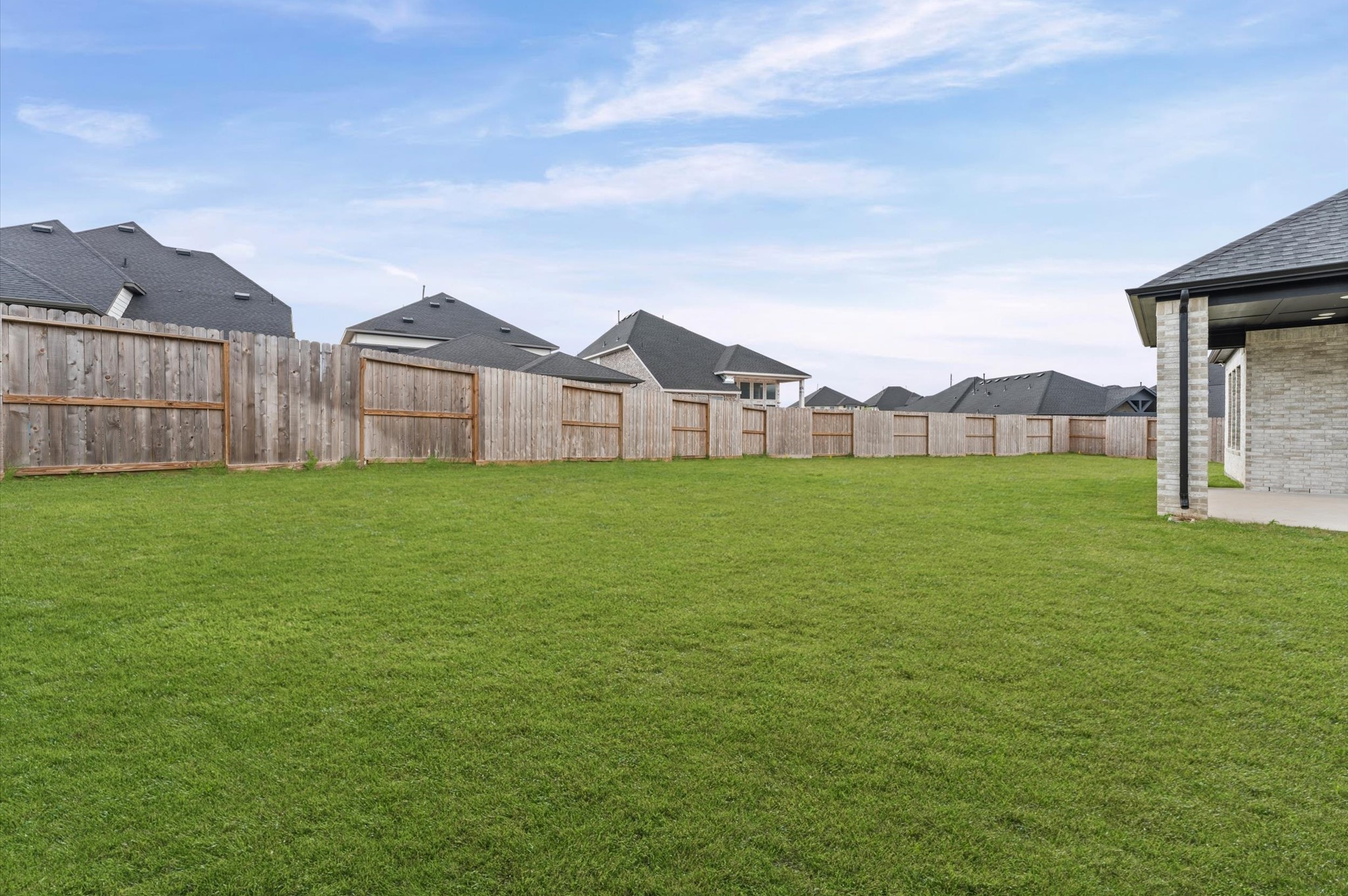 7327 Trial Rdg Drive Fulshear, TX 77441 - Photo 17 of 24 A clean, open backyard with room to make it your own — entertain, let the kids run, or start planning that outdoor kitchen.