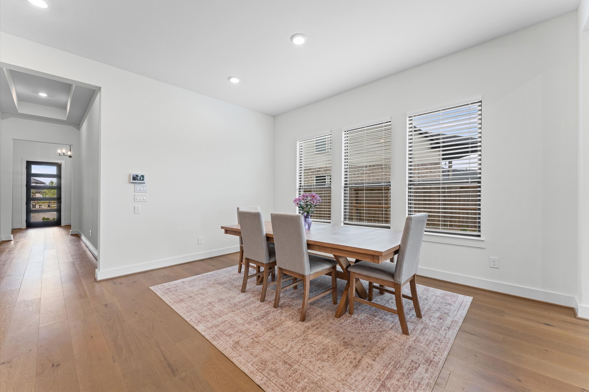7327 Trial Rdg Drive Fulshear, TX 77441 - Photo 5 of 24 Bright and open dining space flows seamlessly into the main living areas — perfect for everyday meals or hosting without feeling cramped.