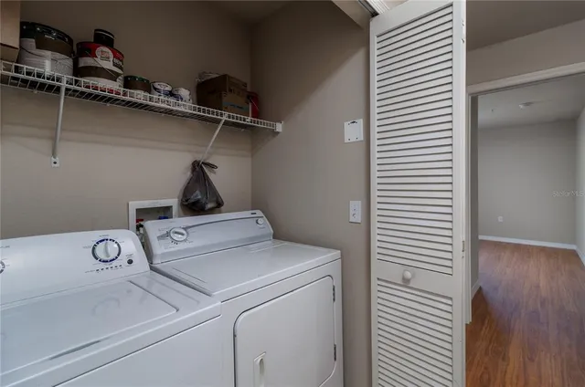 a view of storage and utility room with washer and dryer
