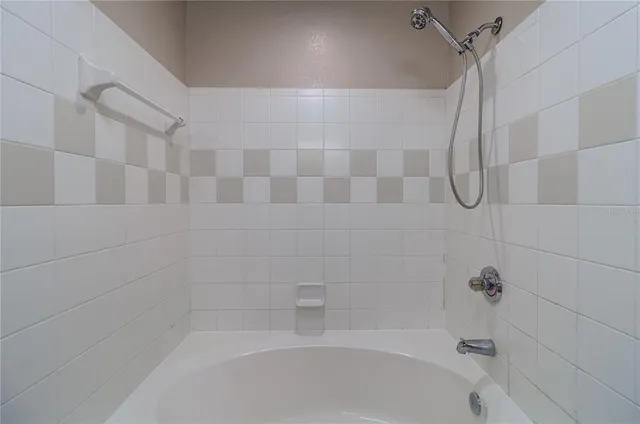 a bathroom with a shower and a bathtub