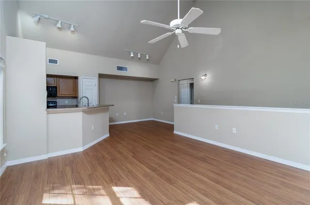 a view of a kitchen with a sink and a kitchen view