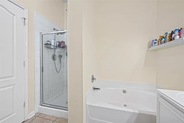 a bathroom with a sink bath tub and a mirror