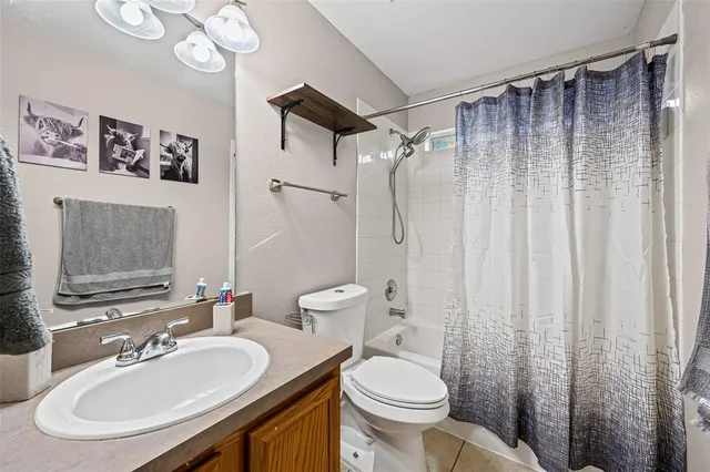 a living room with furniture a window and a chandelier