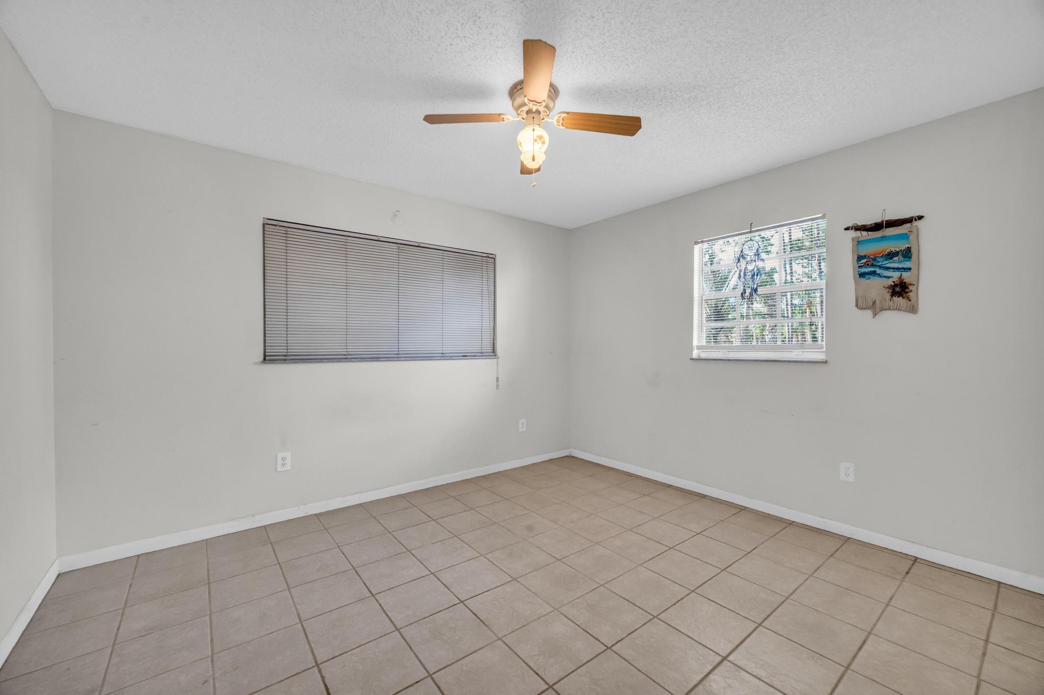 5406 Sunset Boulevard Fort Pierce, FL 34982 - Photo 16 of 33 a view of an empty room with a window