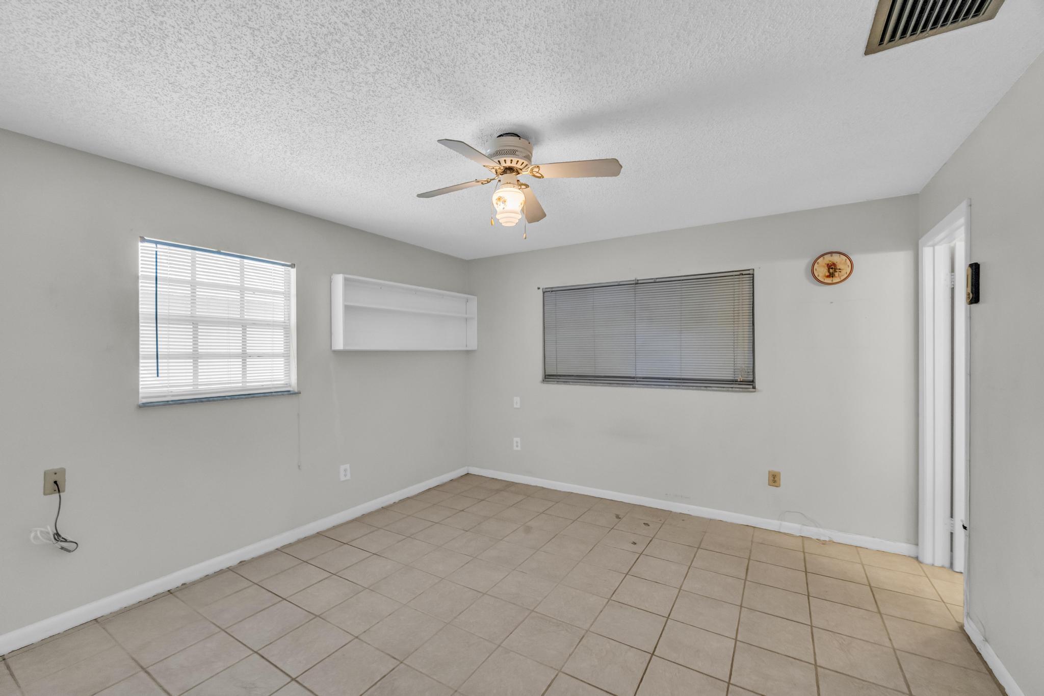 5406 Sunset Boulevard Fort Pierce, FL 34982 - Photo 18 of 33 a view of an empty room with a window