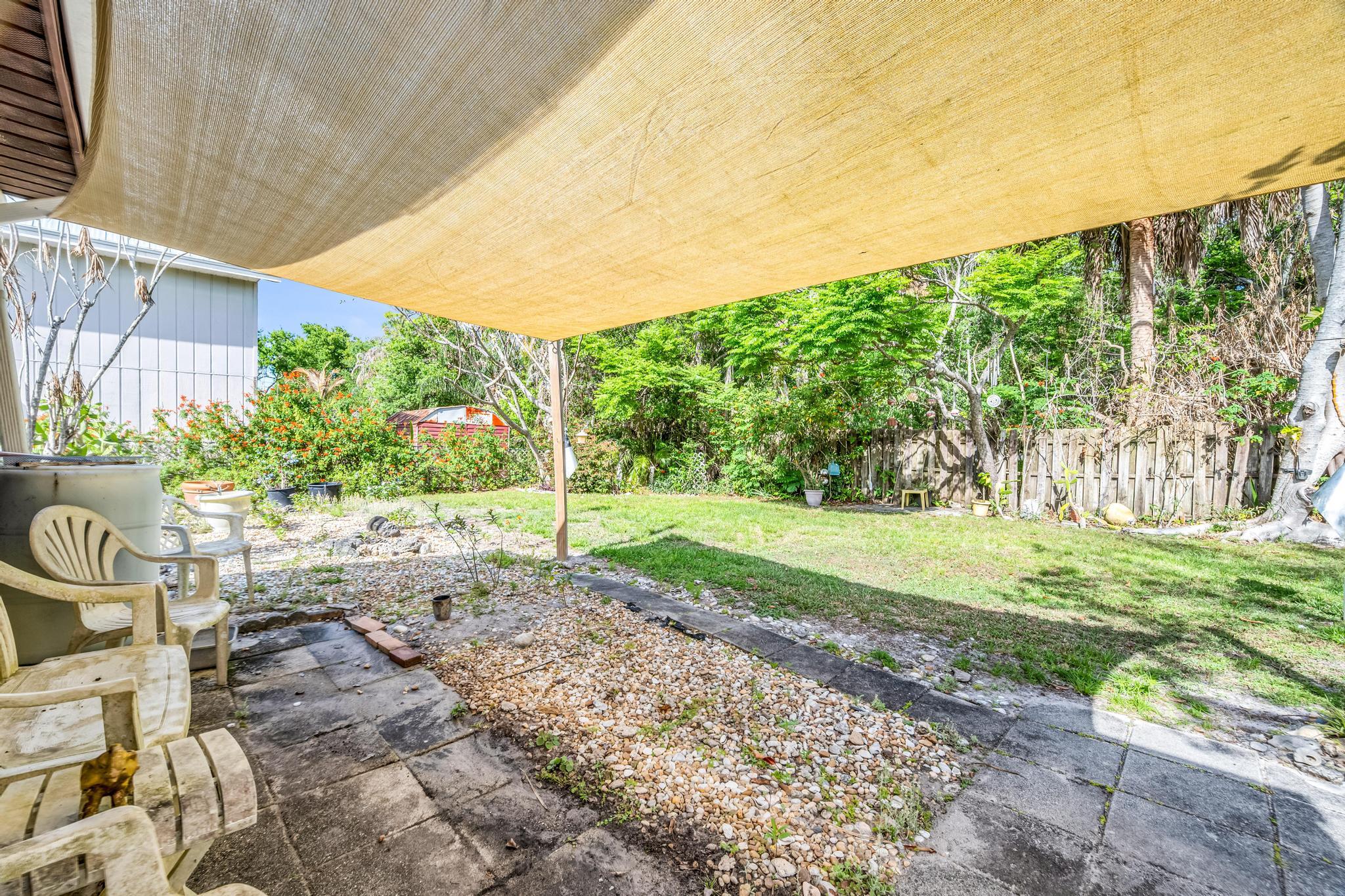 5406 Sunset Boulevard Fort Pierce, FL 34982 - Photo 23 of 33 a view of a yard with plants and a garden