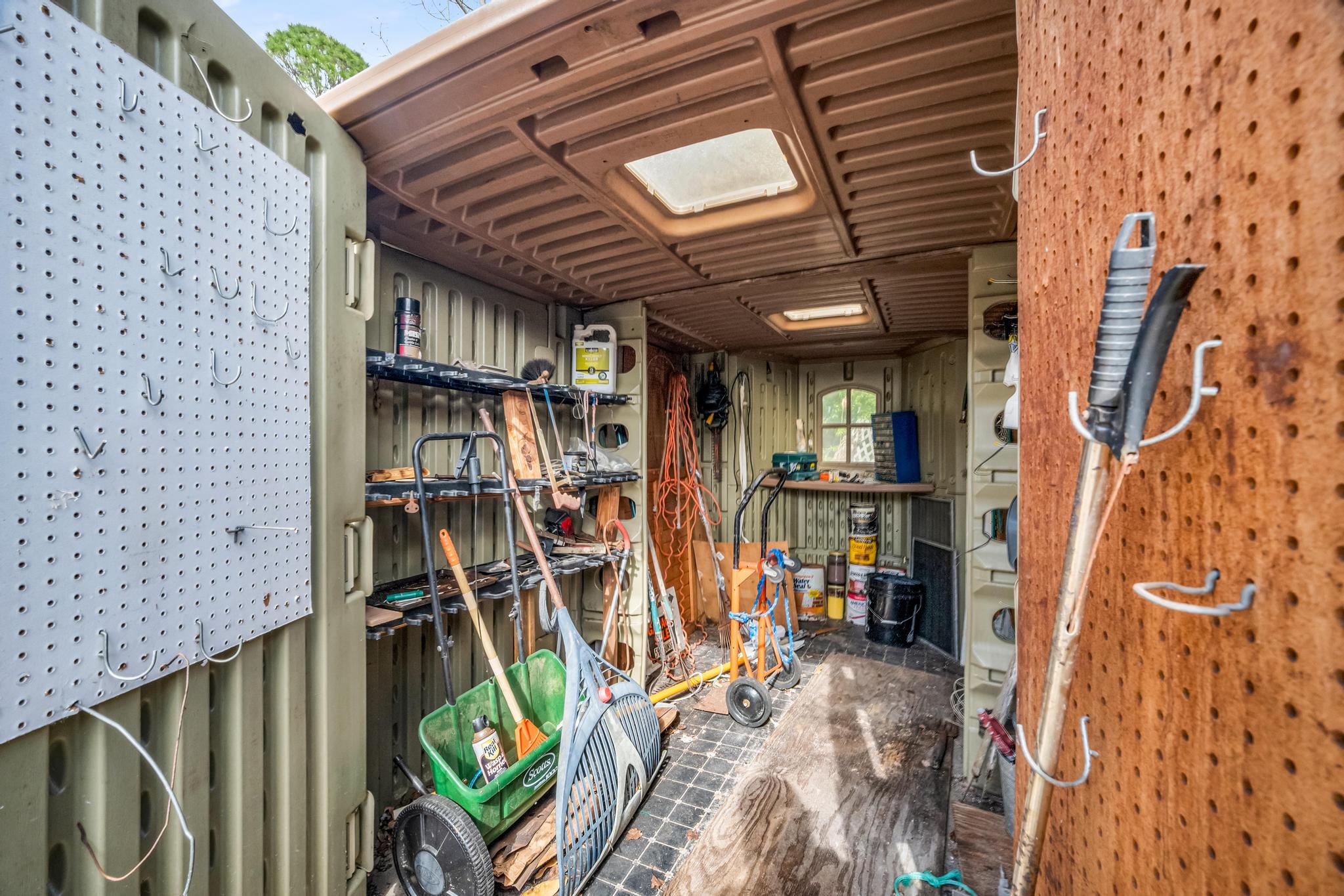 5406 Sunset Boulevard Fort Pierce, FL 34982 - Photo 27 of 33 a view of walk in closet with clothes