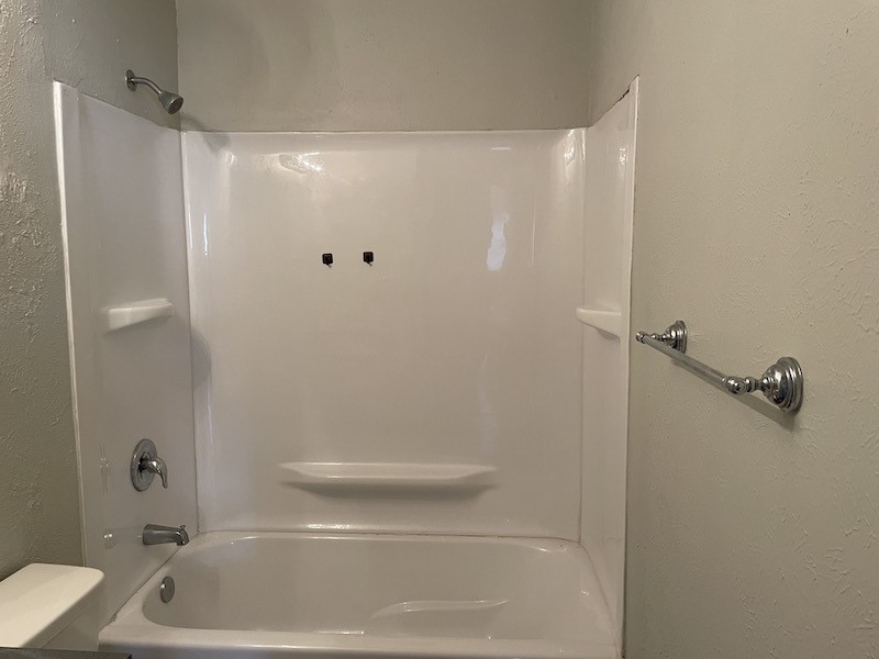8401 Colony Loop Drive, Unit D Austin, TX 78724 - Photo 8 of 18 a bathroom with a shower and a toilet
