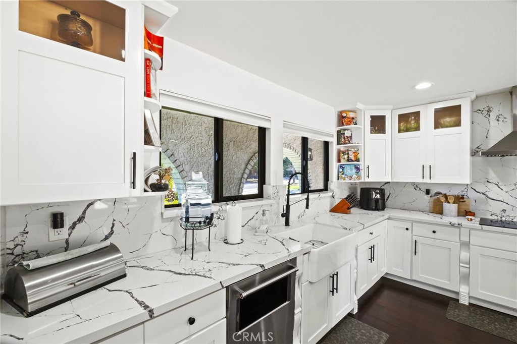 7710 Broadacre Place Riverside, CA 92504 - Photo 13 of 65 a bathroom with a double vanity sink and mirror