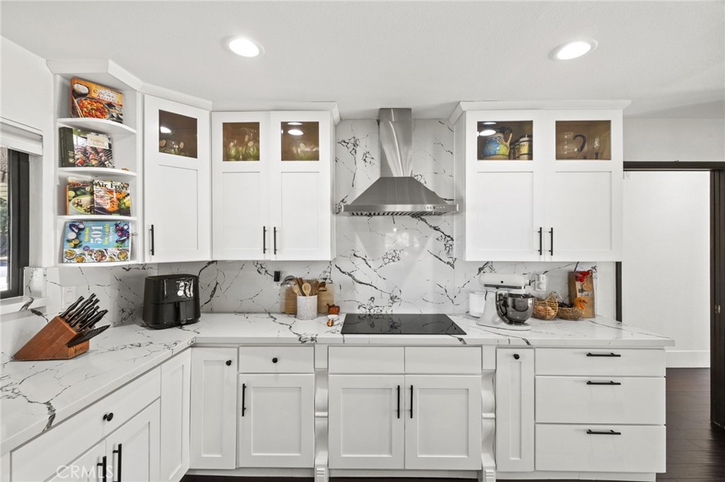 7710 Broadacre Place Riverside, CA 92504 - Photo 14 of 65 a kitchen with cabinets and window