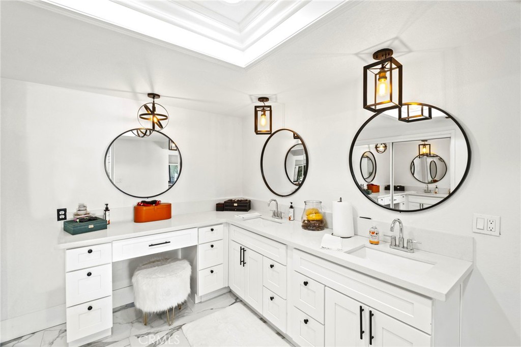 7710 Broadacre Place Riverside, CA 92504 - Photo 27 of 65 a bathroom with a toilet a sink and a mirror