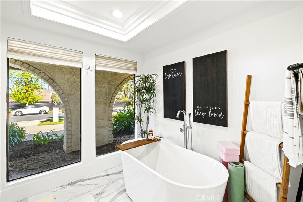 7710 Broadacre Place Riverside, CA 92504 - Photo 28 of 65 a living room with large window and a wooden floor