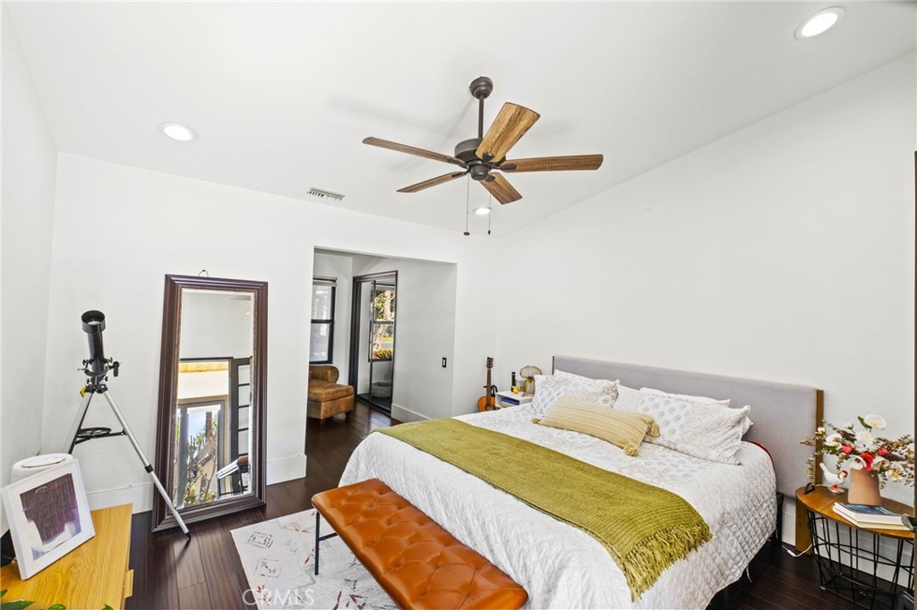 7710 Broadacre Place Riverside, CA 92504 - Photo 30 of 65 a bedroom with a bed and a chandelier