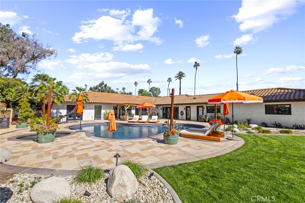 7710 Broadacre Place Riverside, CA 92504 - Photo 38 of 65 a view of a house with swimming pool and sitting area