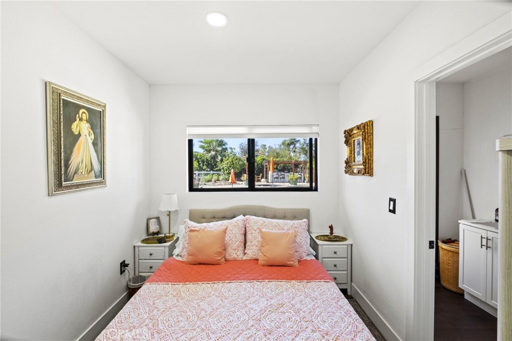 7710 Broadacre Place Riverside, CA 92504 - Photo 49 of 65 a bedroom with a bed and a painting on the wall