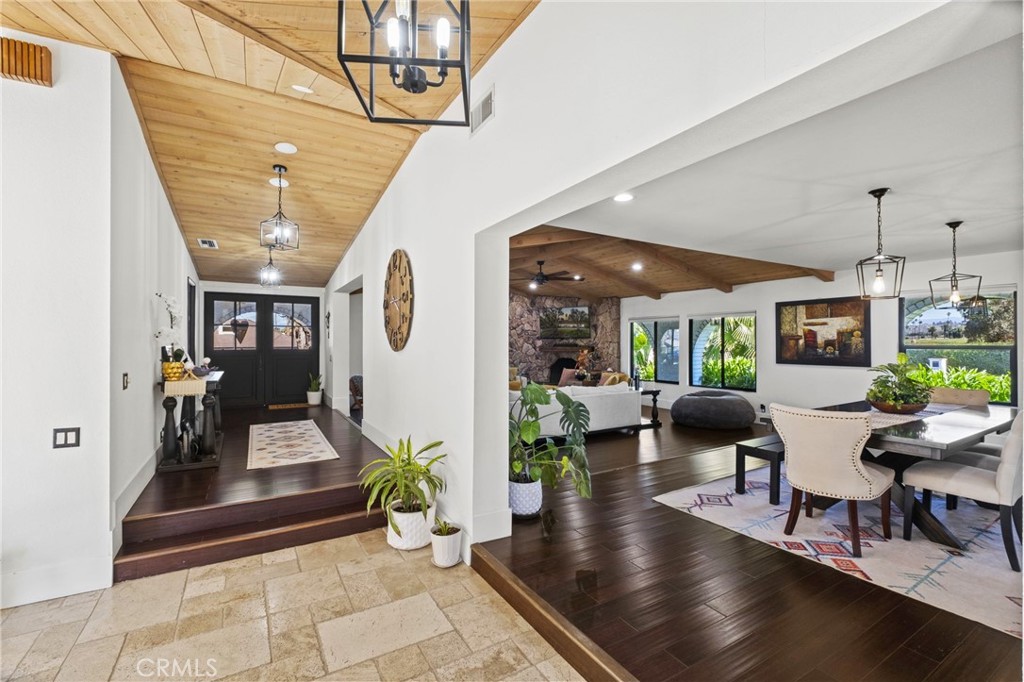 7710 Broadacre Place Riverside, CA 92504 - Photo 6 of 65 a living room with furniture and a wooden floor