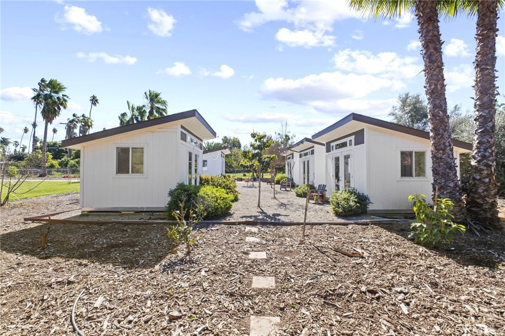 7710 Broadacre Place Riverside, CA 92504 - Photo 64 of 65 a view of a house with a yard and potted plants